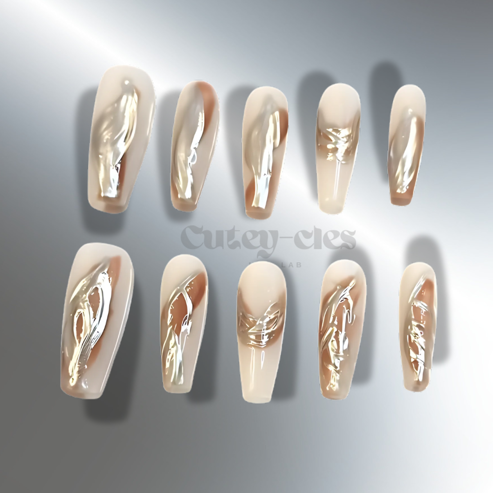 Gold metallic coffin press on nails for weddings with marble accents in neutral tones, featuring intricate details and a luxurious finish.