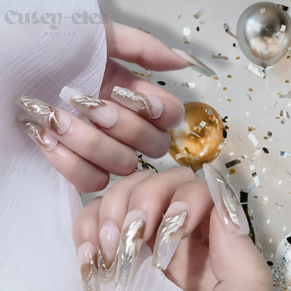Gold metallic coffin press on nails for weddings with marble accents in neutral tones, featuring intricate details and a luxurious finish.