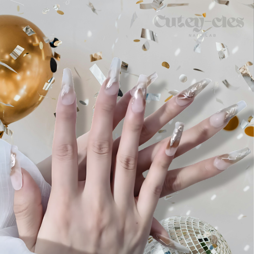 Gold metallic coffin press on nails for weddings with marble accents in neutral tones, featuring intricate details and a luxurious finish.