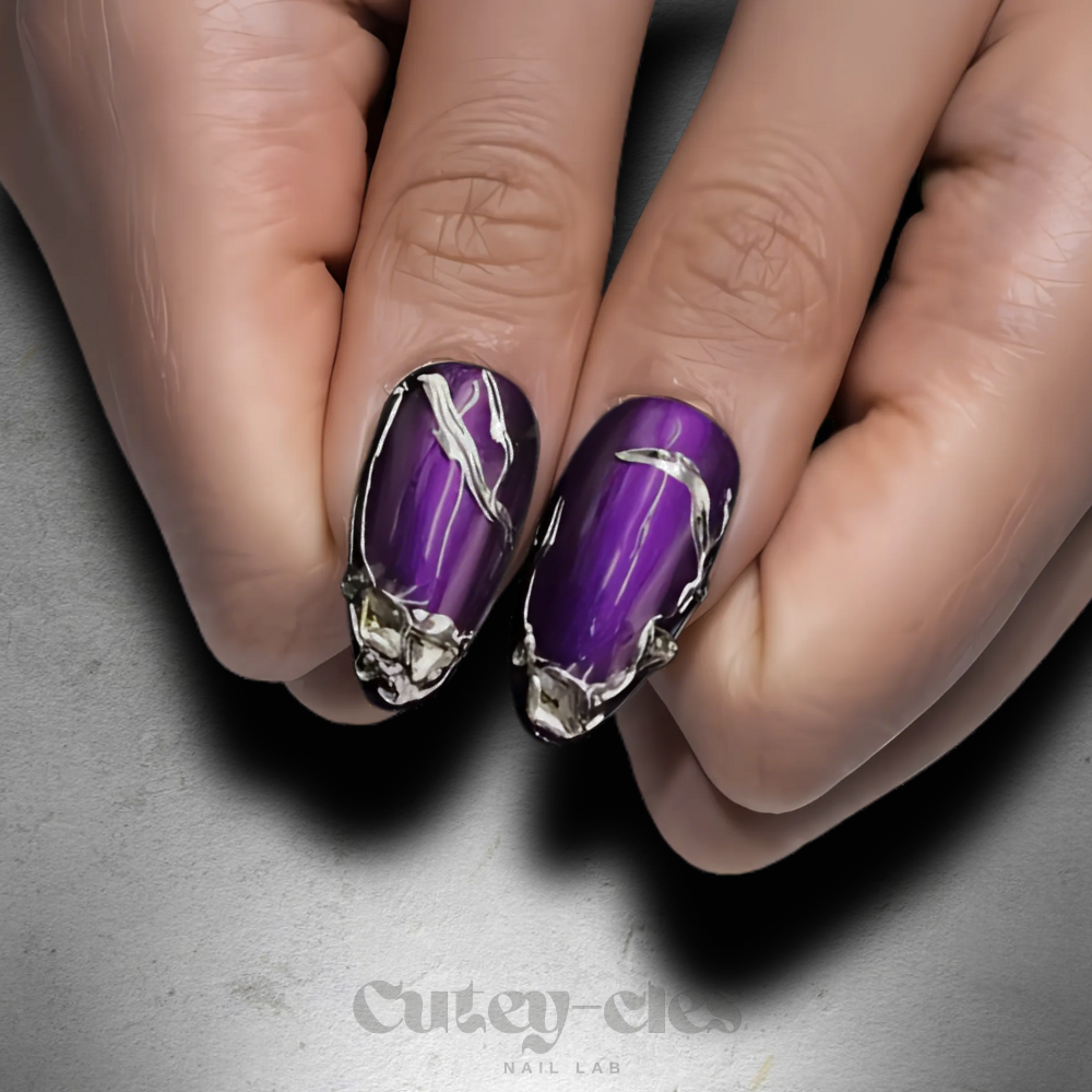 Medium almond nails featuring deep amethyst purple polish with silver metallic 3D chrome accents