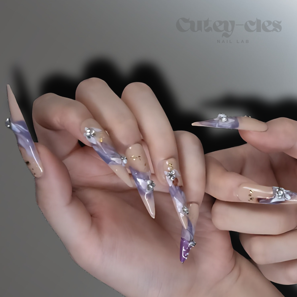 3XL long glam press-on nails in peach and lavender with 3D floral embellishments and marbled Art Nouveau-inspired design.