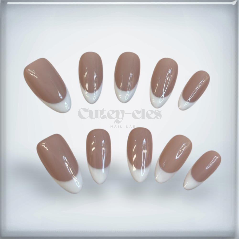 Elegant almond-shaped French tip nails with clean white tips, ideal for a classic and versatile look