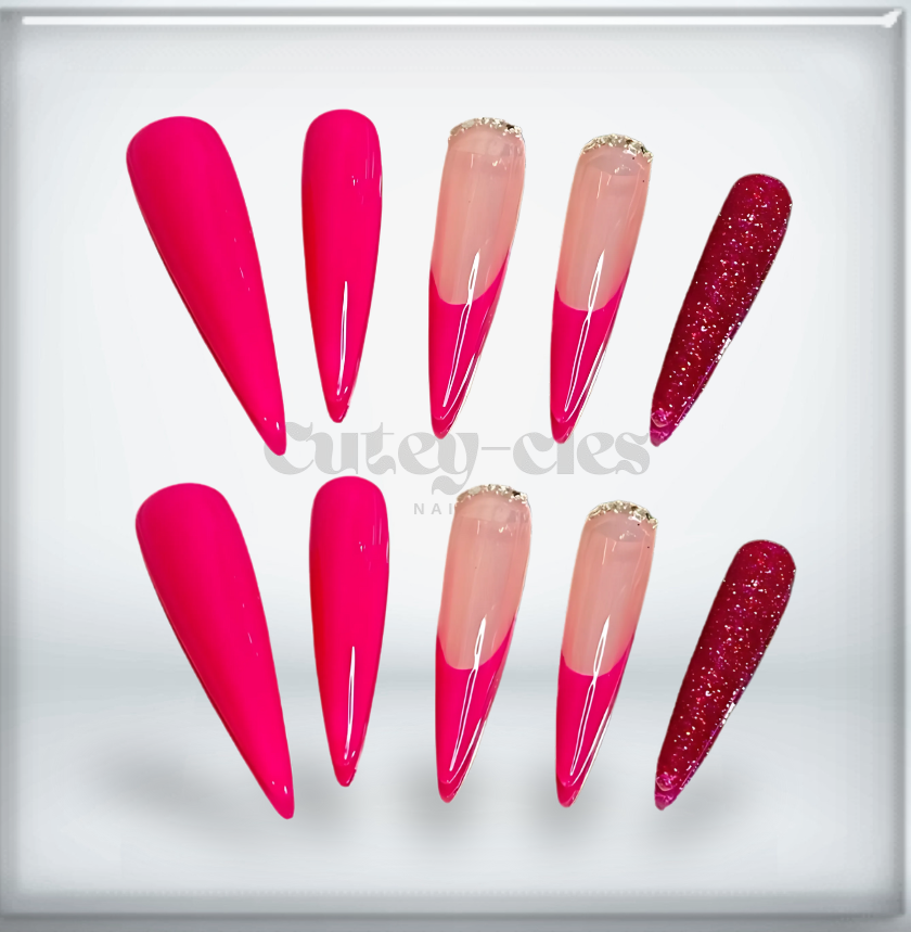 Hot pink stiletto press-on nails with a glossy finish and glitter accent details.