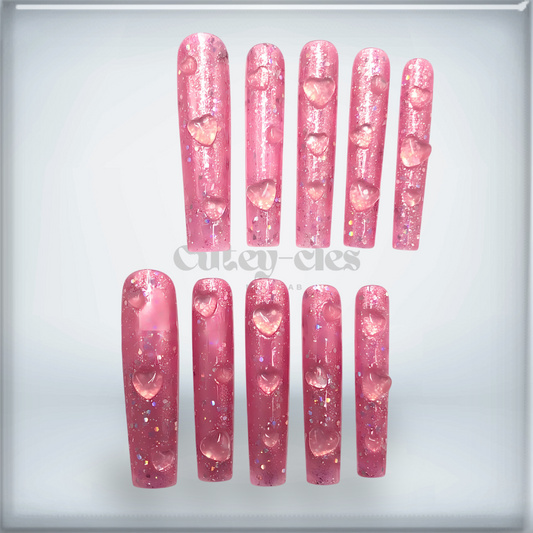 3XL Glitter Heart Press-On Nails with pink glitter and 3D heart accents, perfect for Valentine's Day or glamorous events.