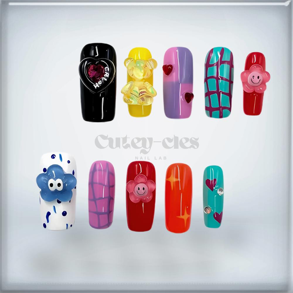 Medium square press-on nail set with bold designs, including kawaii-style charms and colorful patterns.