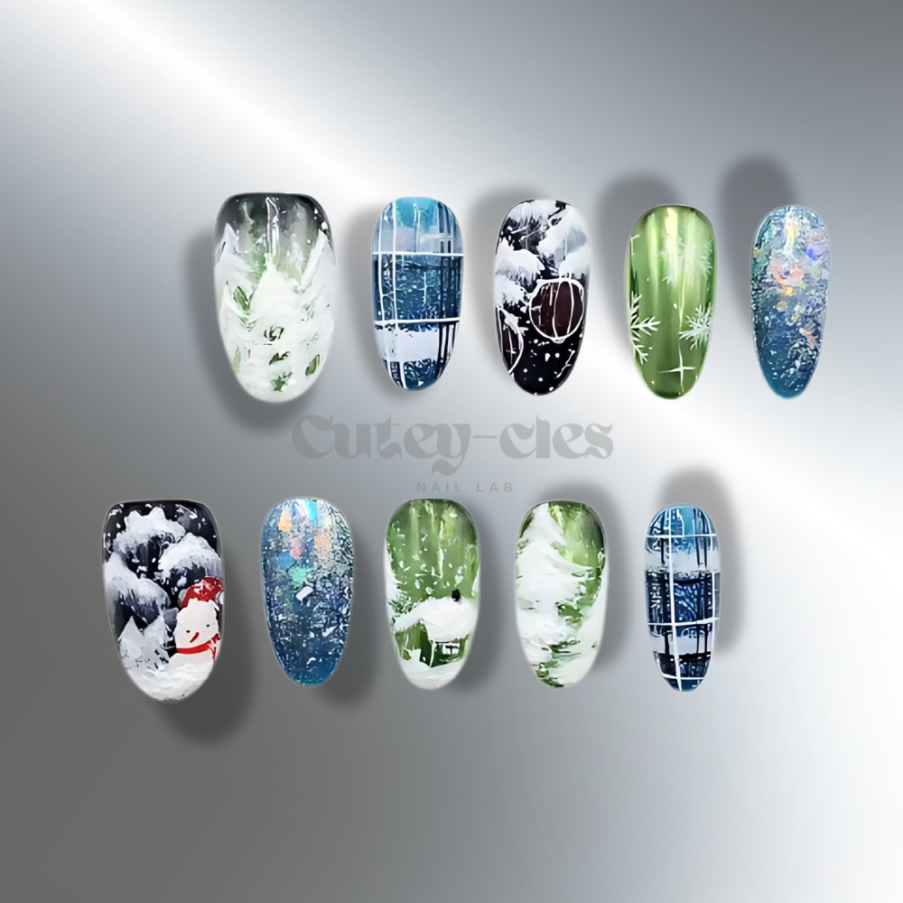 Hand-painted winter-themed press-on nails with snowflake and frosted tree, inspired by snow and winter landscapes.