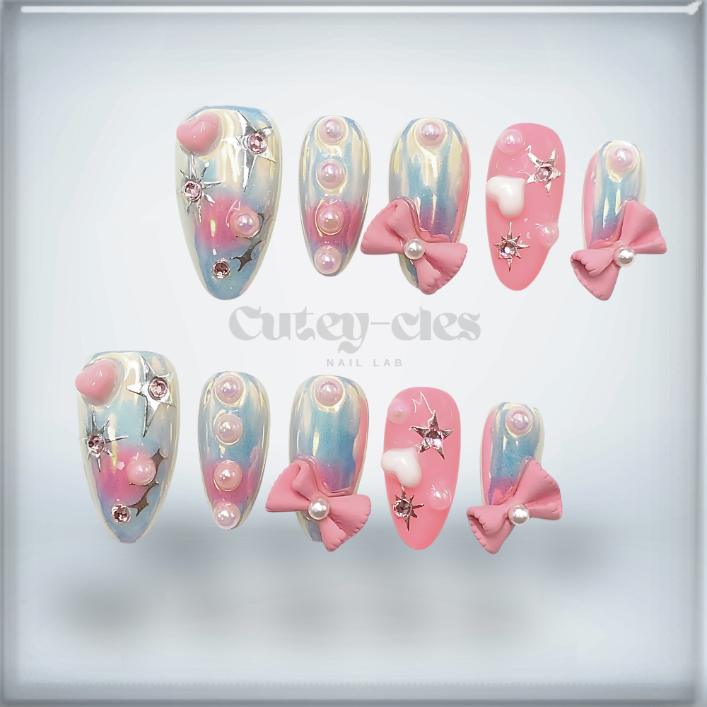 Medium almond press-on nail set showcasing pastel gradient designs, 3D bows, and pearls for a whimsical look.