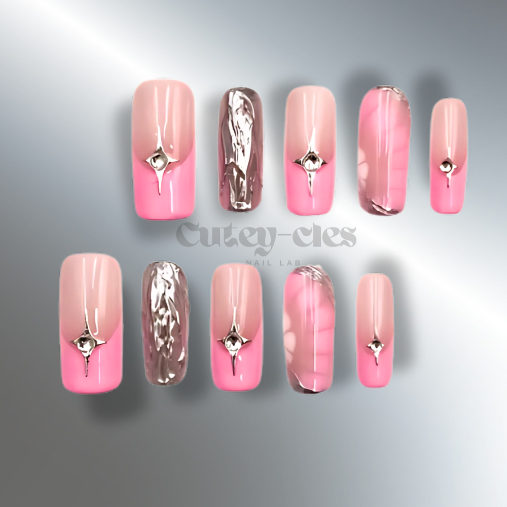 Chic pink and chrome press-on nails with gemstone accents in square shape, medium length.