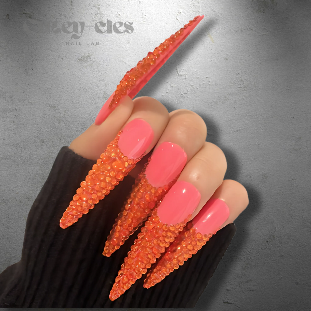 Vibrant 3XL red stiletto nails with crystal embellishments, showcasing a bold and luxurious design.