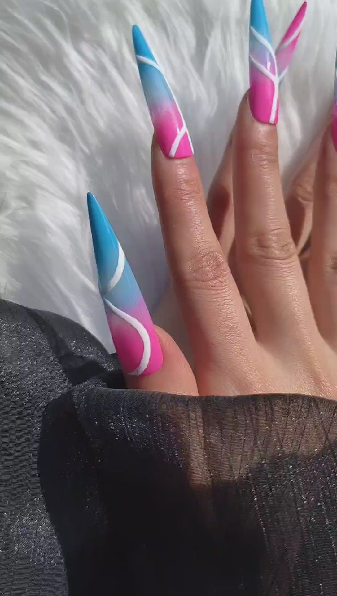 3XL stiletto press-on nails with a vibrant neon pink and blue base, featuring bold abstract white line art and a dramatic glossy finish.